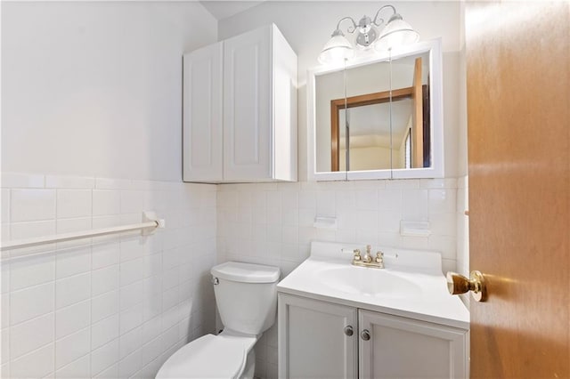 half bathroom featuring toilet and vanity