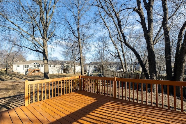 wooden deck featuring a residential view and fence