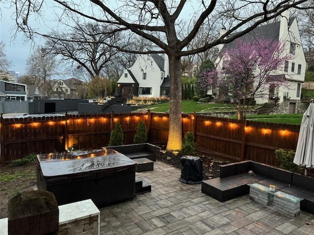 view of patio / terrace featuring an outdoor living space with a fire pit and a fenced backyard