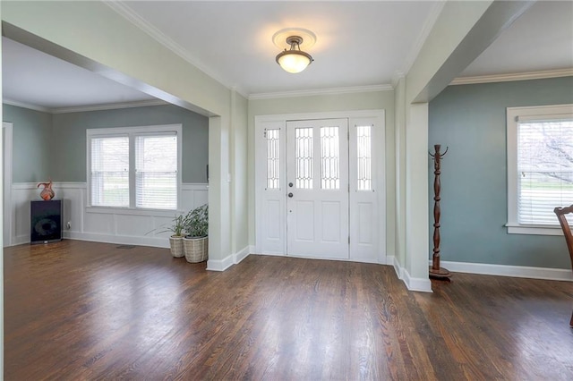 entrance foyer with crown molding, wood finished floors, and a wealth of natural light