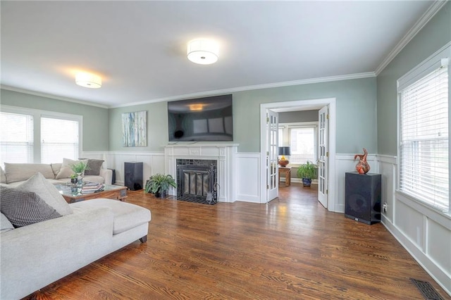 living area featuring plenty of natural light and dark wood-style floors