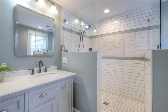 bathroom with vanity and a walk in shower