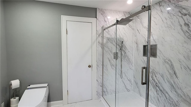 bathroom with a marble finish shower and toilet