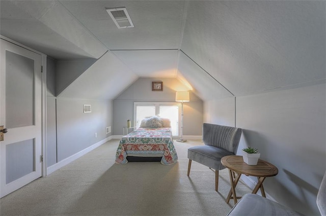 carpeted bedroom featuring visible vents, a textured ceiling, baseboards, and vaulted ceiling