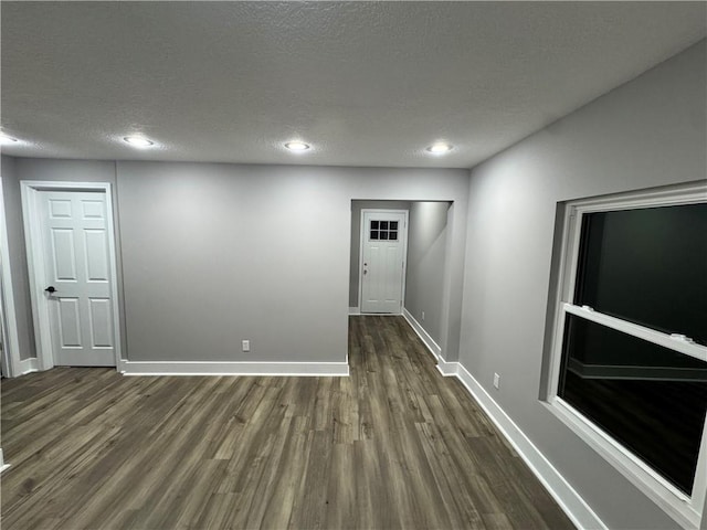 415 E Hale St, Spring Hill, KS 66083 - spare room featuring dark wood-type flooring, a textured ceiling, and recessed lighting
