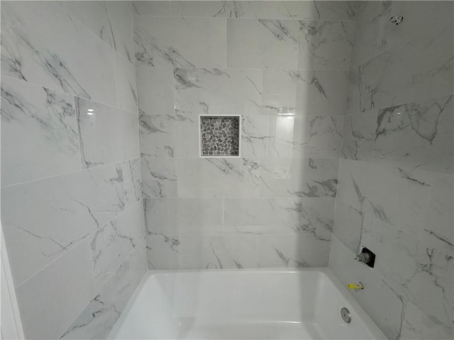 415 E Hale St, Spring Hill, KS 66083 - bathroom featuring bathing tub / shower combination