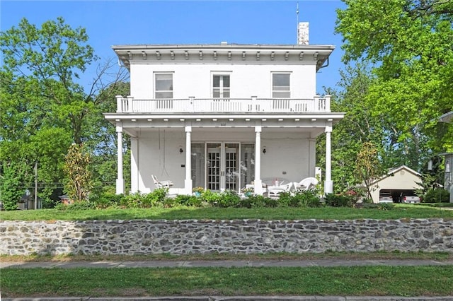 928 S Esplanade St, Leavenworth, KS 66048 - view of front of house featuring a balcony, french doors, and a chimney