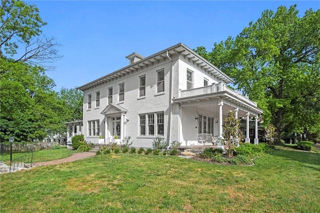 928 S Esplanade St, Leavenworth, KS 66048 - rear view of house with a porch and a balcony