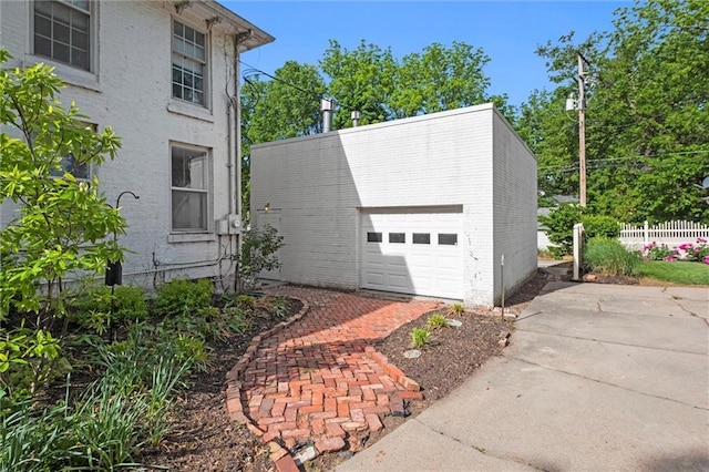 928 S Esplanade St, Leavenworth, KS 66048 - view of home's exterior featuring fence, a garage, and driveway