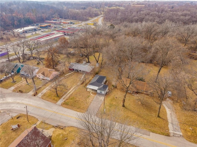 birds eye view of property featuring a wooded view