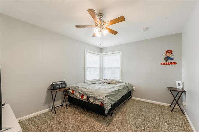 bedroom featuring ceiling fan, carpet, and baseboards