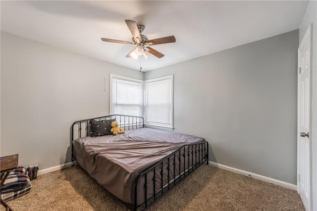 bedroom featuring a ceiling fan, carpet, and baseboards