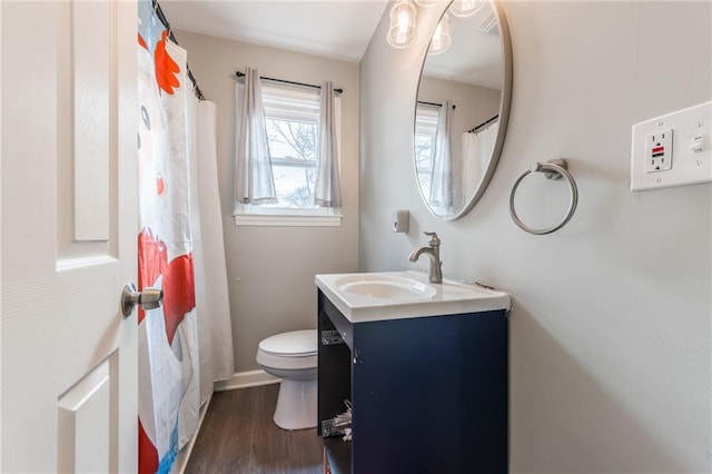 full bath with vanity, wood finished floors, toilet, and baseboards