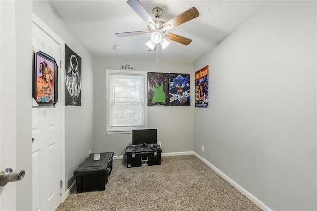 misc room with ceiling fan, carpet, and baseboards