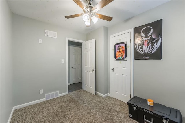 bedroom with ceiling fan, carpet, visible vents, and baseboards