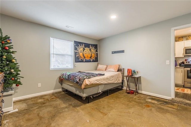 bedroom featuring visible vents, concrete floors, and baseboards