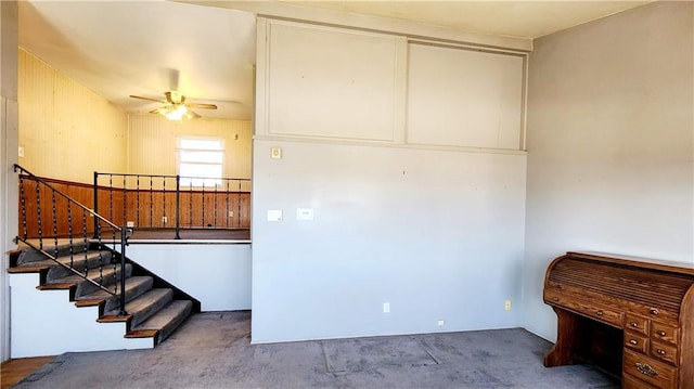 interior space featuring ceiling fan