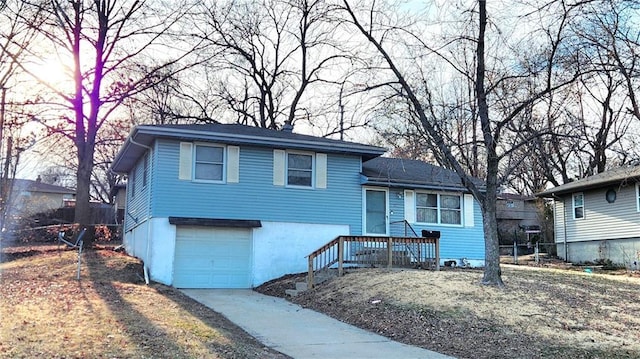 split level home featuring a garage and driveway