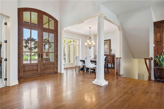15300 Mastin St, Overland Park, KS 66221 - entryway featuring wood finished floors, an inviting chandelier, and ornamental molding