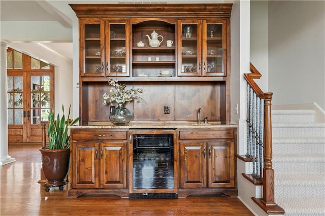 15300 Mastin St, Overland Park, KS 66221 - bar with indoor wet bar, stairway, dark wood-style floors, beverage cooler, and a sink