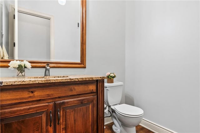 15300 Mastin St, Overland Park, KS 66221 - half bathroom with toilet, vanity, and baseboards