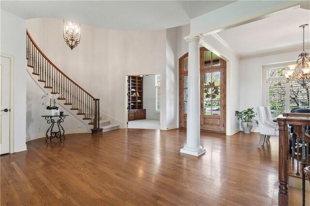 15300 Mastin St, Overland Park, KS 66221 - foyer entrance with baseboards, decorative columns, a chandelier, stairway, and wood finished floors