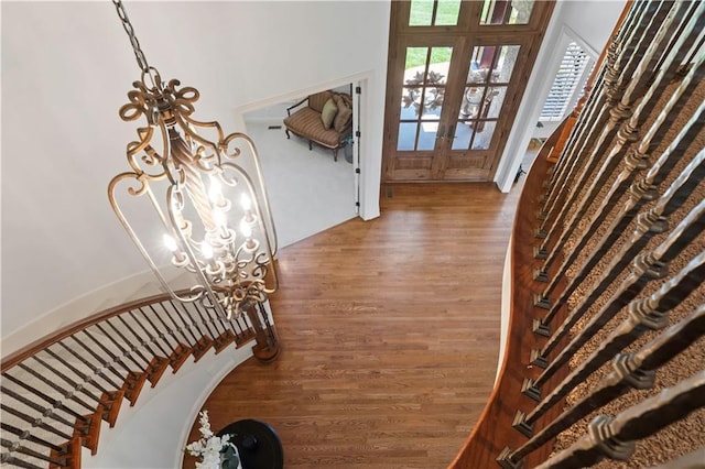 15300 Mastin St, Overland Park, KS 66221 - entryway with french doors, wood finished floors, and stairway