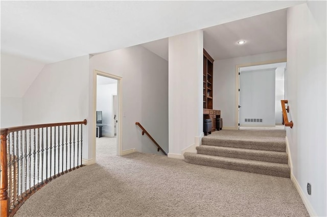 15300 Mastin St, Overland Park, KS 66221 - corridor with visible vents, baseboards, an upstairs landing, carpet, and lofted ceiling
