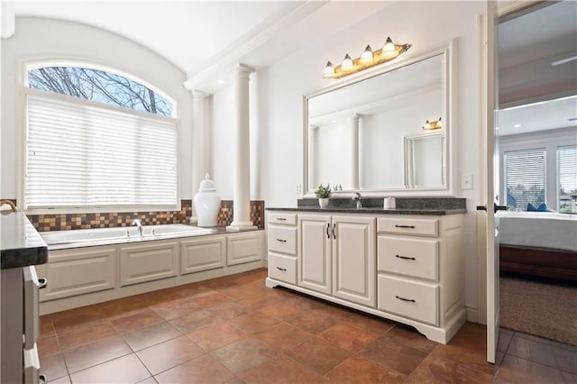 15300 Mastin St, Overland Park, KS 66221 - ensuite bathroom featuring a wealth of natural light, ensuite bathroom, a garden tub, and decorative columns
