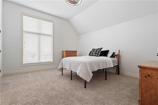15300 Mastin St, Overland Park, KS 66221 - carpeted bedroom featuring baseboards and vaulted ceiling