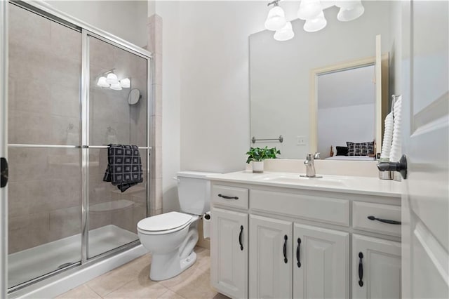 15300 Mastin St, Overland Park, KS 66221 - bathroom featuring toilet, tile patterned floors, a stall shower, and vanity