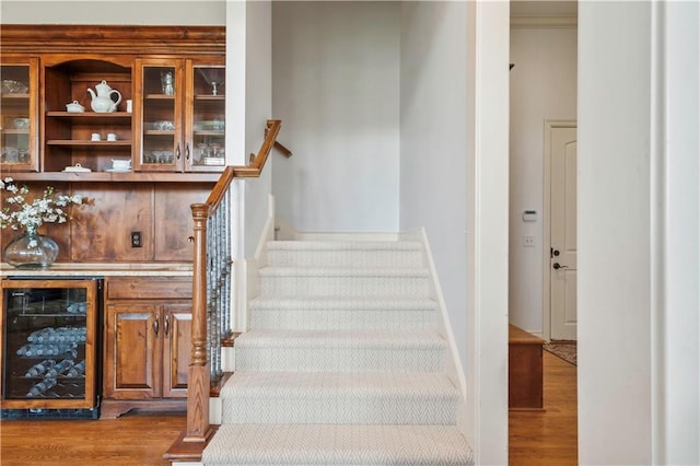 15300 Mastin St, Overland Park, KS 66221 - stairway with wood finished floors, baseboards, and beverage cooler
