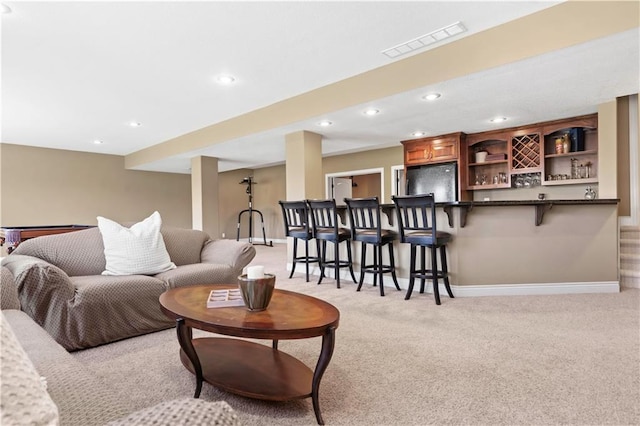 15300 Mastin St, Overland Park, KS 66221 - living room with light colored carpet, visible vents, recessed lighting, a bar, and baseboards