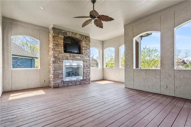 15300 Mastin St, Overland Park, KS 66221 - wooden deck featuring a ceiling fan and a fireplace
