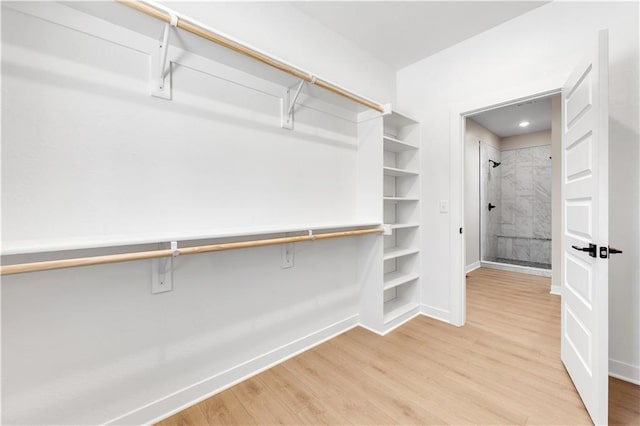 spacious closet with light wood finished floors