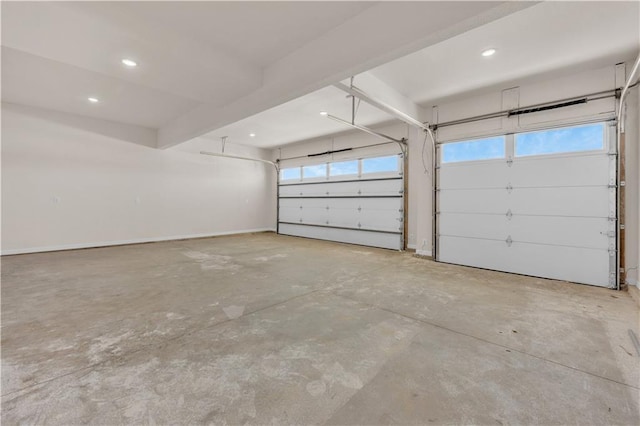 garage featuring baseboards and recessed lighting