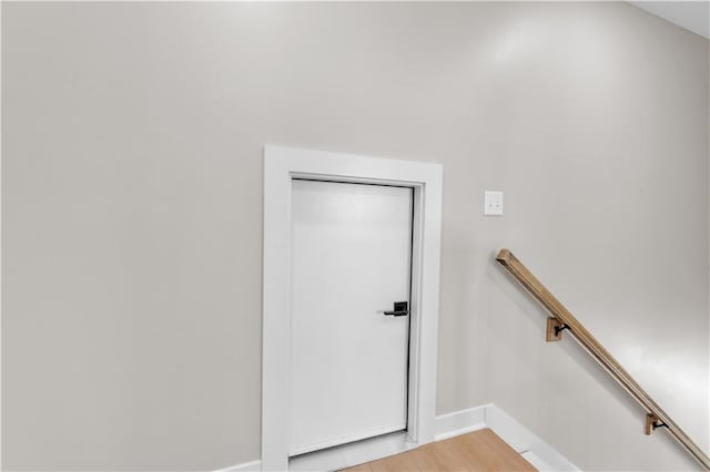 interior space featuring wood finished floors and baseboards