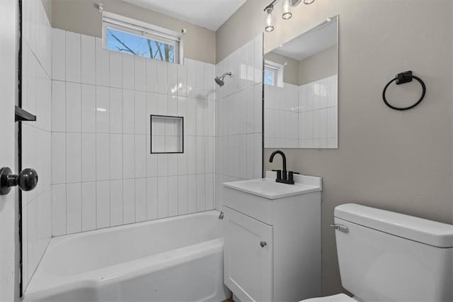 bathroom featuring shower / washtub combination, vanity, and toilet