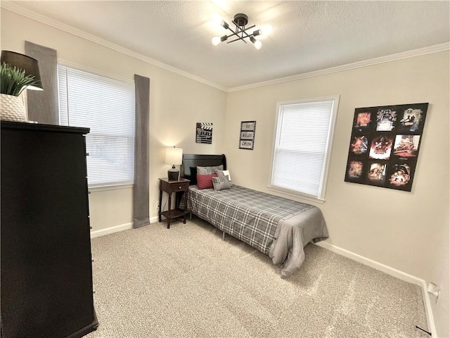 bedroom with carpet floors, baseboards, ornamental molding, and a textured ceiling