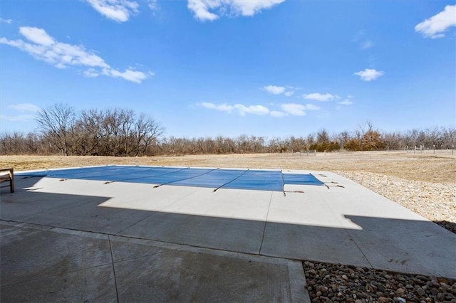 view of pool featuring a patio area and a covered pool