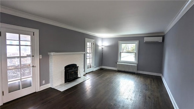 unfurnished living room with baseboards, radiator heating unit, wood finished floors, a wall mounted air conditioner, and crown molding