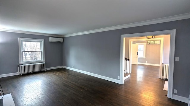 empty room featuring a wall unit AC, radiator heating unit, ornamental molding, and dark wood-style flooring