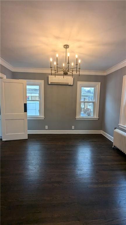 unfurnished dining area with baseboards, ornamental molding, radiator heating unit, a wall mounted air conditioner, and dark wood finished floors