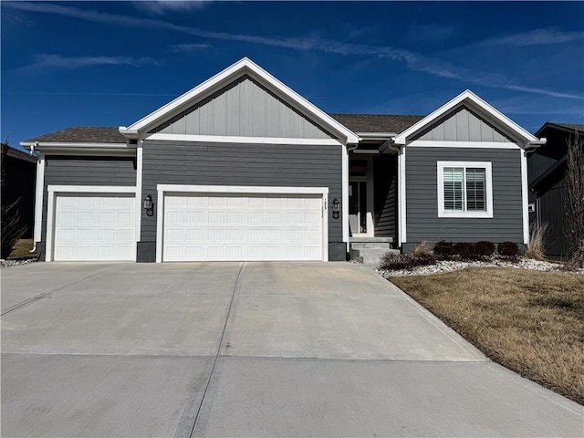 ranch-style house with a garage, concrete driveway, and roof with shingles