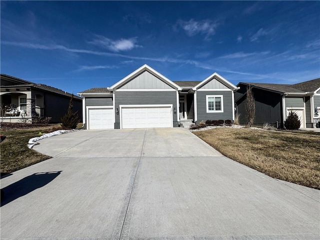 ranch-style house with a garage, concrete driveway, and board and batten siding