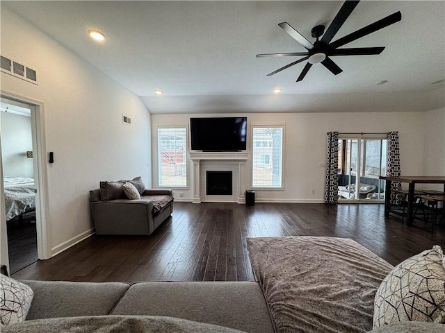 living room featuring a healthy amount of sunlight, wood-type flooring, and visible vents