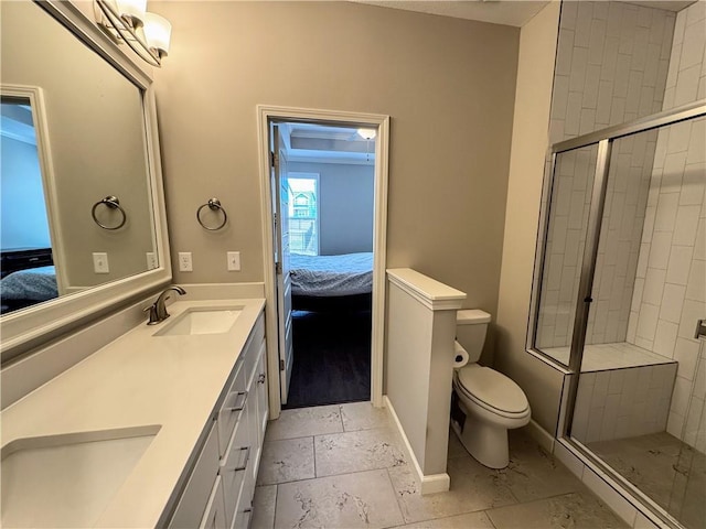 ensuite bathroom with a sink, toilet, and ensuite bathroom