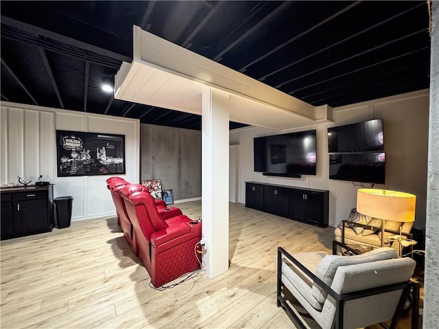 cinema room featuring wood finished floors