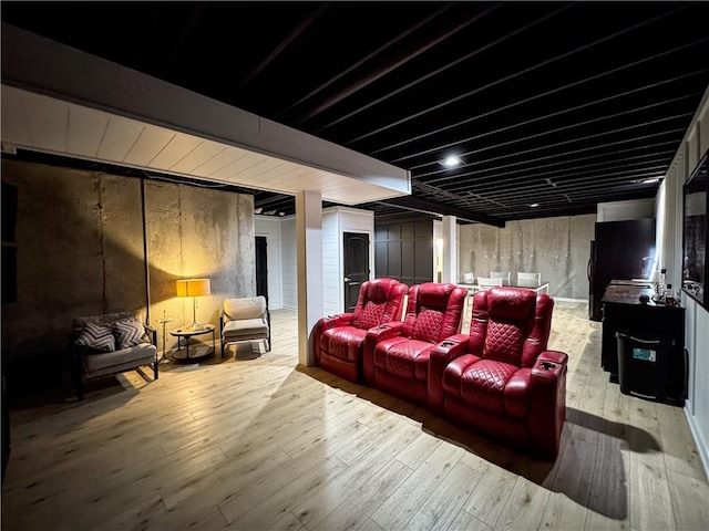 cinema room with wood-type flooring