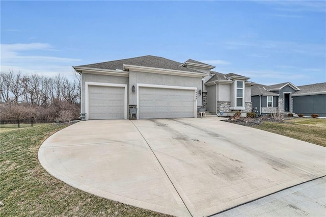 prairie-style home with a garage, driveway, a front lawn, and stucco siding